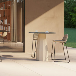 Maarten padded outdoor designer stool by Viccarbe in a garden| Aiure
