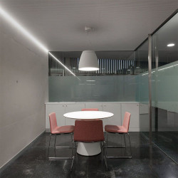 White pendant ceiling lamp in an office from the Salt series by Arkoslight | Aiure