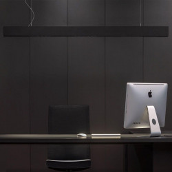 Black LED pendant light Black Foster Suspension by Arkoslight hanging over an office desk| Aiure