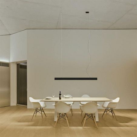 Black LED pendant light Black Foster Suspension by Arkoslight hanging over a dining table | Aiure
