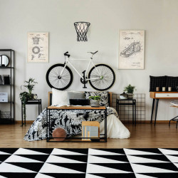 Black wall sconce in the shape of a basketball hoop in bedroom from the Basketball collection by Mantra | Aiure