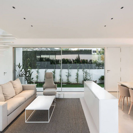 Black Foster Asymmetric Trimless recessed downlight by Arkoslight in a living room | Aiure