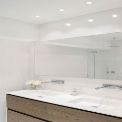 Several Arkoslight Bath downlights switched on over a mirror | Aiure