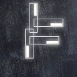 4 apliques rectangulares blancos encendidos sobre una pared. Serie Boutique de Mantra | Aiure